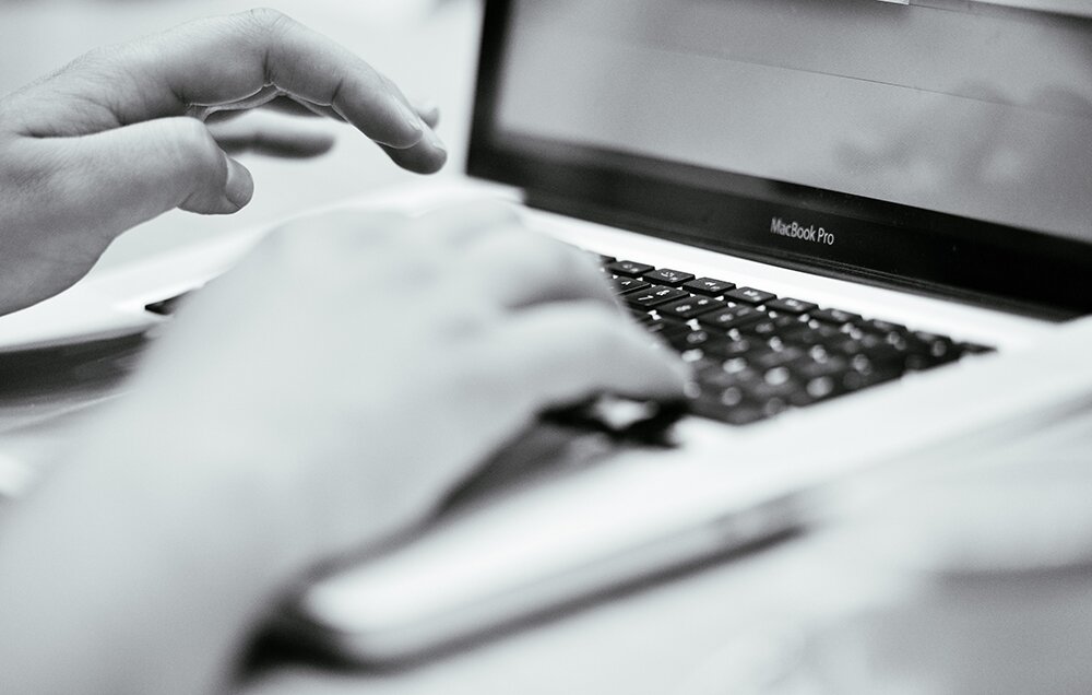 B&W Hands Typing On A Laptop